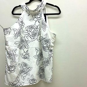 White House Black Market sleeveless blouse with floral design